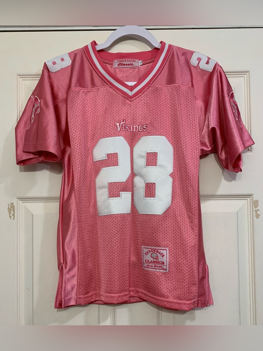 Throw Back Classics Pink Minnesota Vikings Youth Large #28 Jersey.